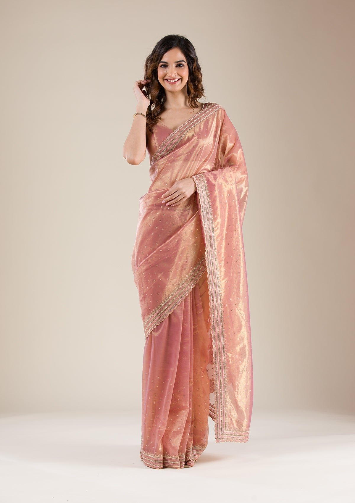 Elegant Pink Tissue Saree with Intricate Zari Work