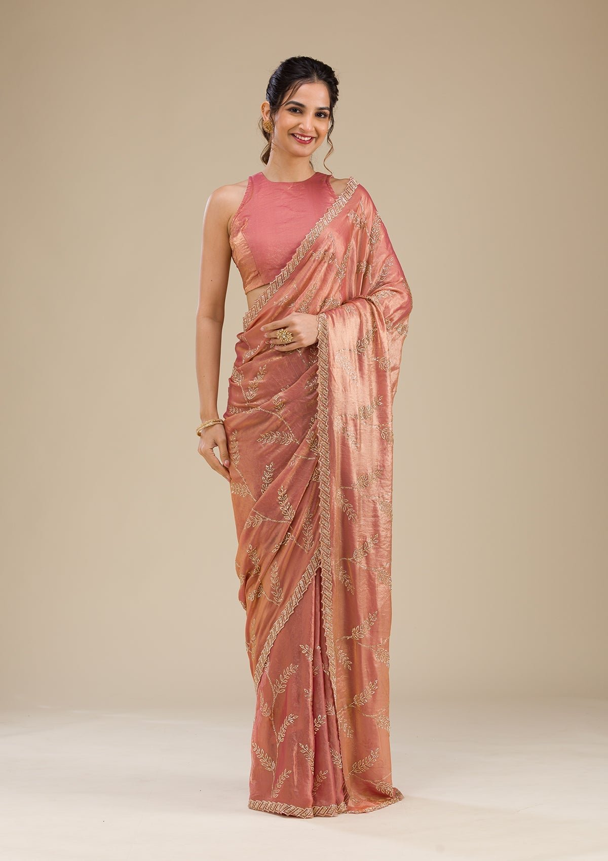 Elegant Peach Stonework Tissue Saree for a Glamorous Look