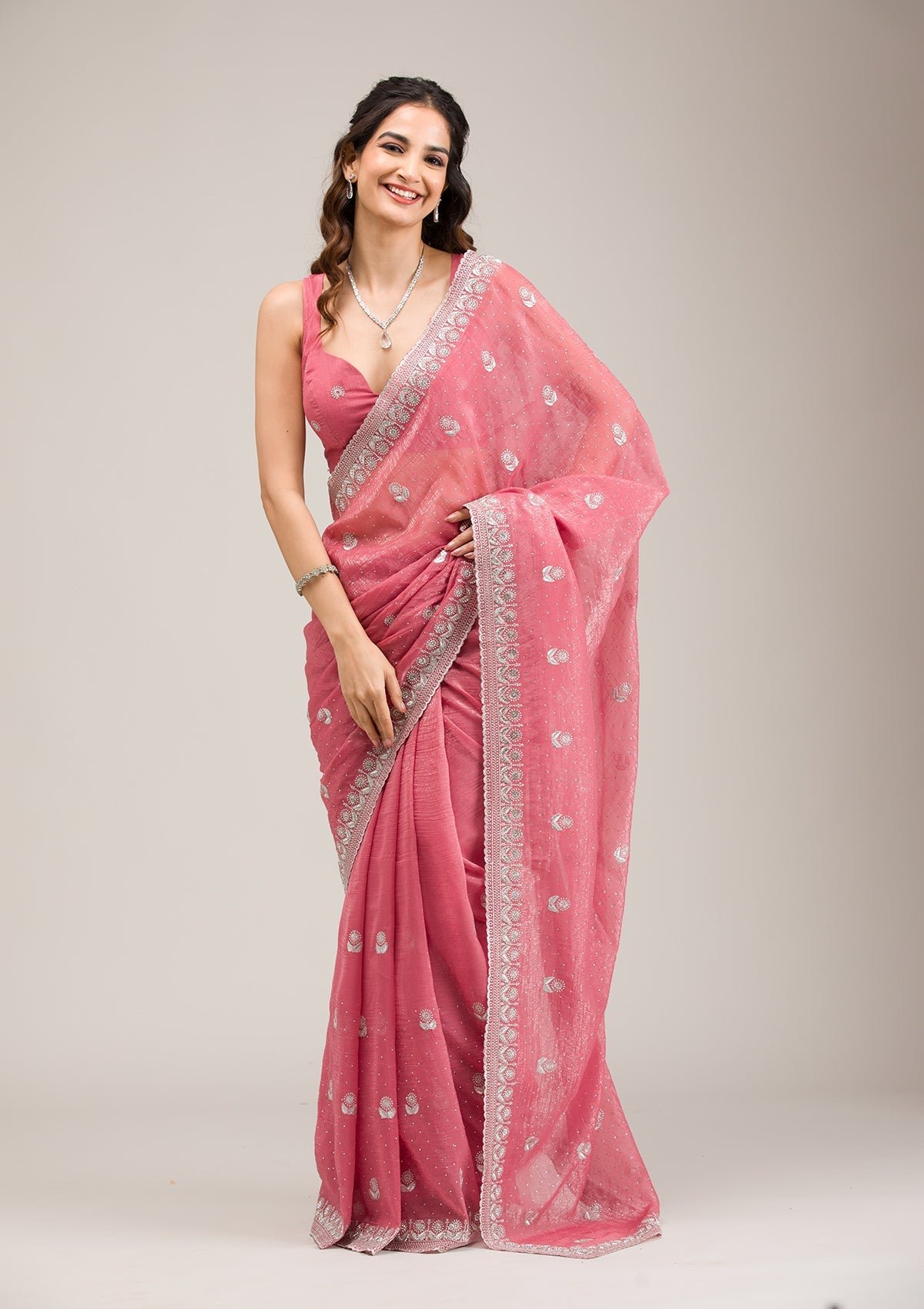 Elegant Pink Tissue Saree with Intricate Zari Work