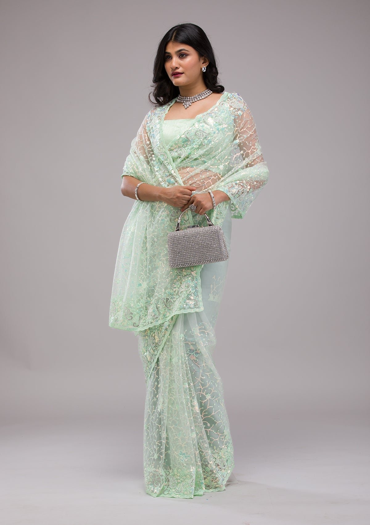 Gorgeous Pista Green Sequined Net Saree for Elegant Occasions