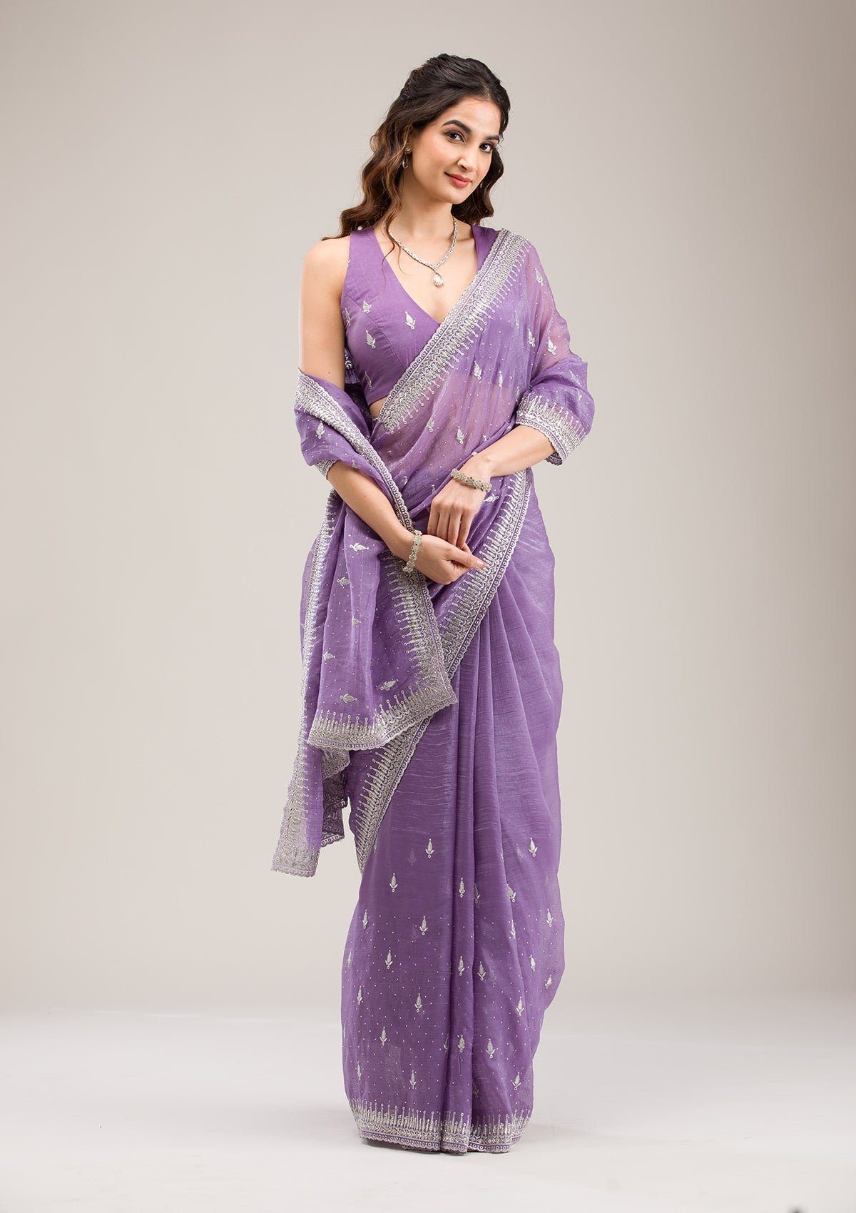 Exquisite Purple Tissue Saree with Zariwork Embellishments