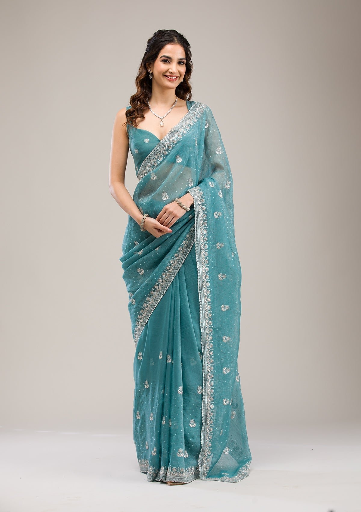 Elegant Sea Green Tissue Saree with Stunning Zari Work