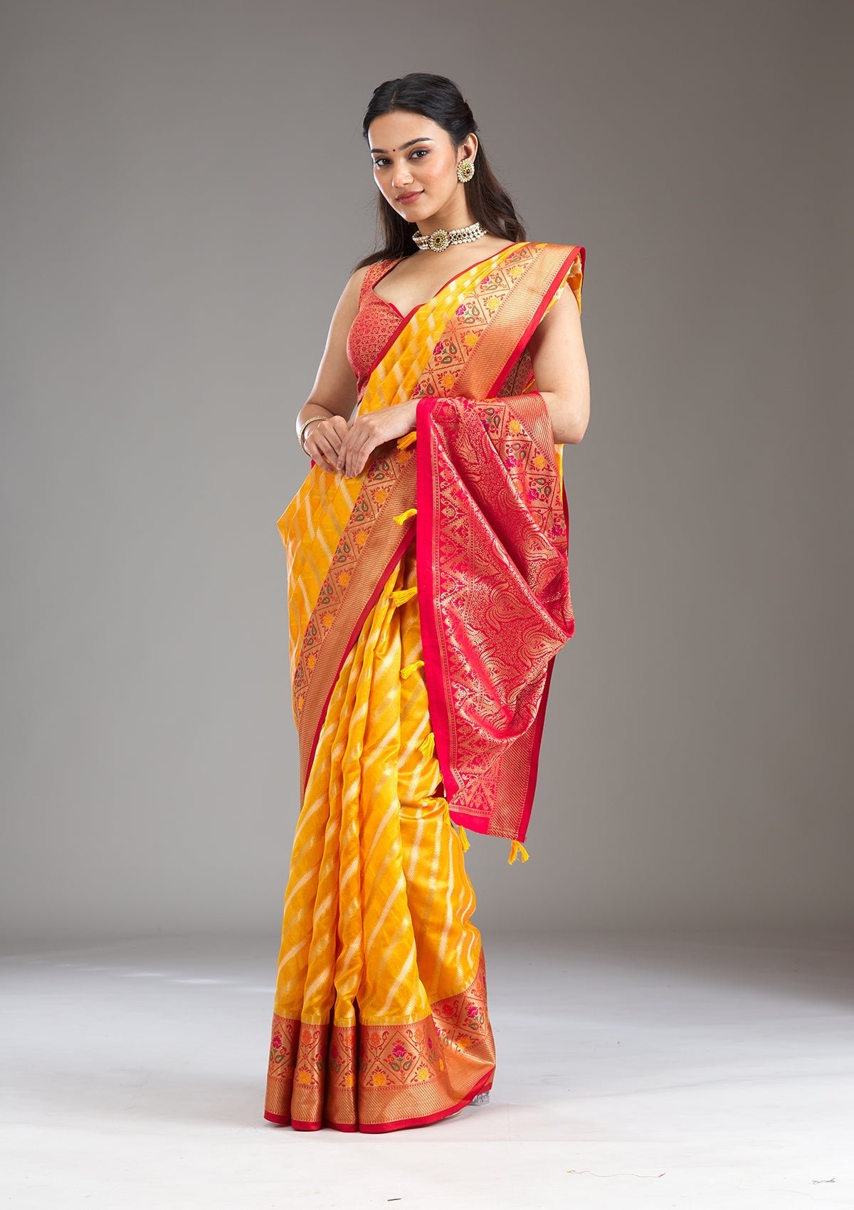Elegant Yellow Tissue Saree with Intricate Zariwork